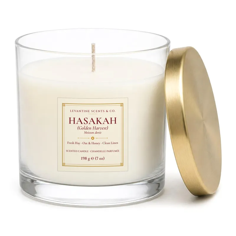 Hasakah 'Golden Harvest' 198 g / 7 oz hand-poured coconut apricot wax candle in a clear jar with gold lid